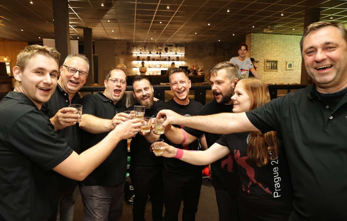 Players celebrating a new friendship over Czech beer